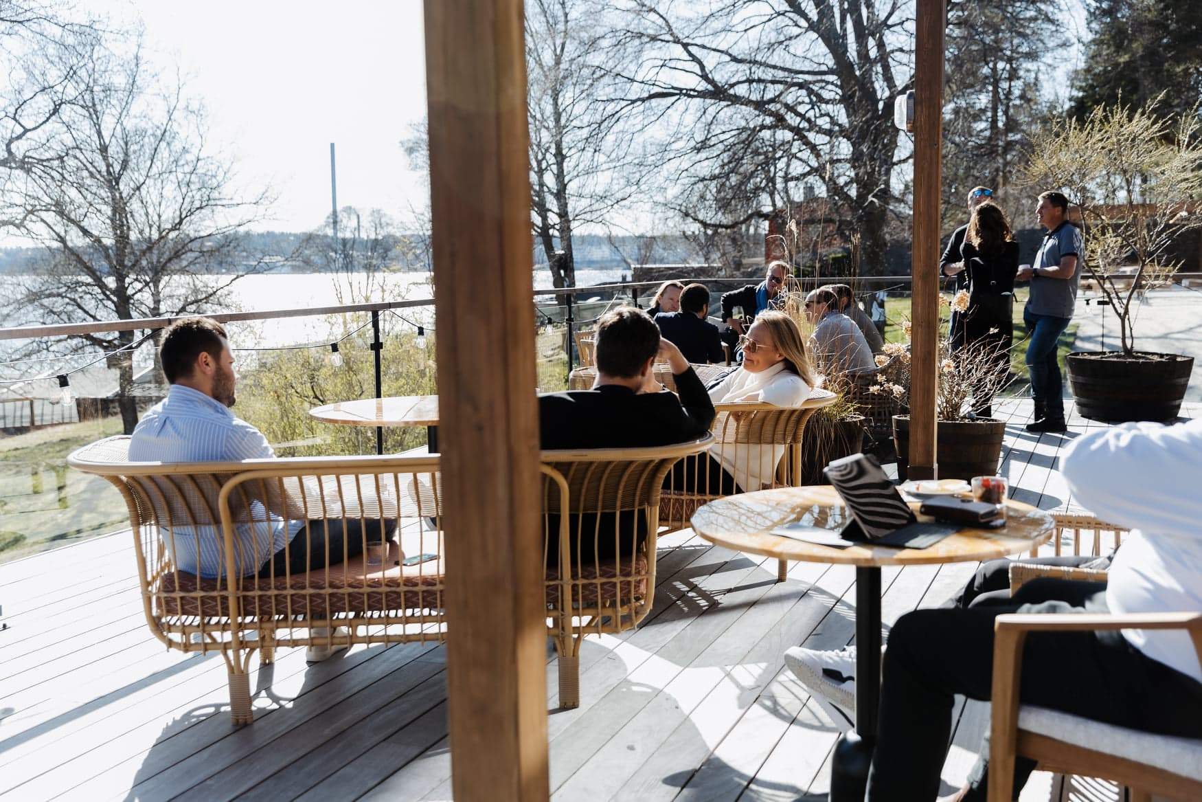 sunny afternoon, people sitting in lounge chairs and talking