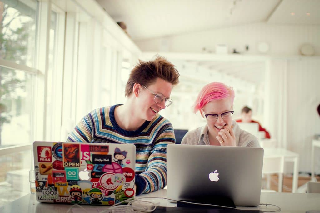two people working on their laptops